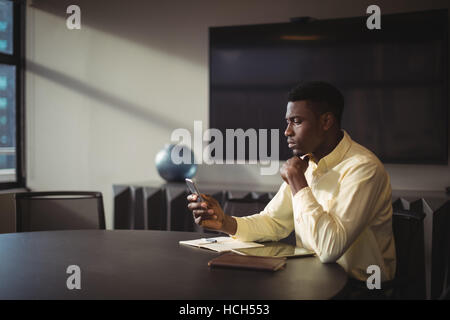 Businessman using mobile phone Stock Photo