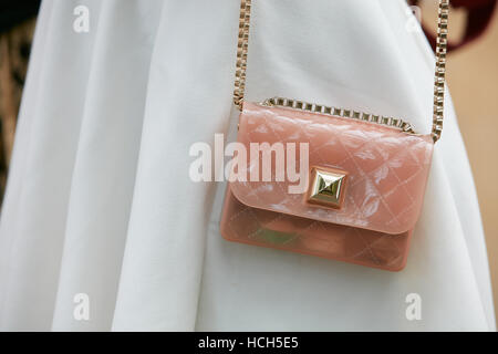 MILAN - SEPTEMBER 23: Woman with pink glitter and white pill shaped bag  before Antonio Marras fashion show, Milan Fashion Week street style on  Septemb Stock Photo - Alamy