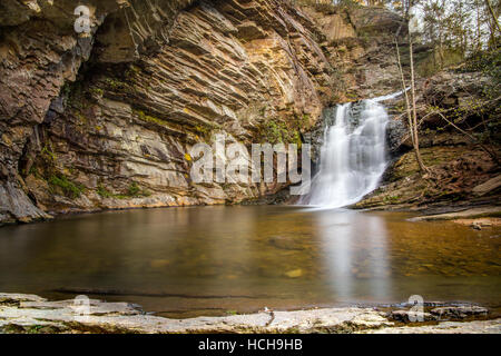 Lower Cascades waterfall in Hanging Rock State Park in North Carolina, USA, showing rocky sides, long exposure water, and reflections in the pool Stock Photo