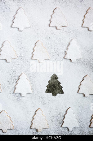 Christmas tree shaped cookies with icing sugar on white background Stock Photo