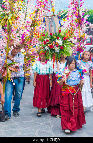 Salvadorian people participate in the procession of the Flower & Palm Festival in Panchimalco, El Salvador Stock Photo