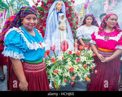 Salvadorian people participate in the procession of the Flower & Palm Festival in Panchimalco, El Salvador Stock Photo