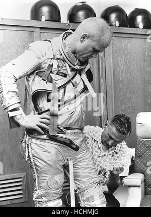 Washington, DC - April 19, 1998 -- Astronaut John H. Glenn, Jr. is assisted by Joe W. Schmitt as he suits up in practice for the perparation of the Mercury-Atlas 6 (MA-6) mission in the photo taken at Cape Canaveral, Florida on February 5, 1962.Credit: NASA/CNP /MediaPunch Stock Photo