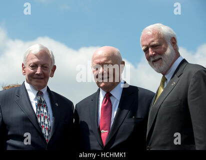 From left to right: General J.R. 'Jack' Dailey, Museum Director, Smithsonian Institution's Steven F. Udvar-Hazy Center; former United States Senator John H. Glenn (Democrat of Ohio), and the first American to Orbit the Earth; and Dr. Wayne Clough, Secretary, Smithsonian Institution; pose for a group photo following the ceremony where the Space Shuttle Discovery was signed over to replace the Space Shuttle Enterprise in Chantilly, Virginia awaiting the arrival of the on Thursday, April 19, 2012. Credit: Ron Sachs/CNP.(RESTRICTION: NO New York or New Jersey Newspapers or newspapers within Stock Photo