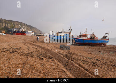 Fishing boats on the beach. Fishermen organizing fishing gear and tools for fishing trip, Hastings East Sussex Credit:  Francisco A. Soeiro/Alamy Live News Stock Photo