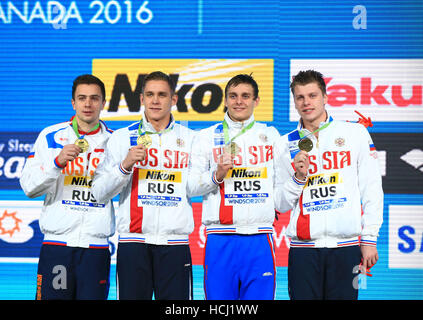 Windsor, Canada. 9th Dec, 2016. Members of team Russia pose for photos during the awarding ceremony of the Men's 4x200m Relay Freestyle final at the 13th FINA World Swimming Championships(25m) in Windsor, Ontario, Canada, Dec. 9, 2016. Team Russia claimed the title with a time of 6 minutes 52.10 seconds. Credit:  Zou Zheng/Xinhua/Alamy Live News Stock Photo