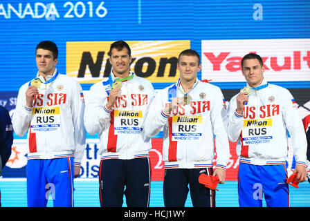 Windsor, Canada. 9th Dec, 2016. Members of team Russia pose for photos during the awarding ceremony of the Men's 4x50m Relay Freestyle final at the 13th FINA World Swimming Championships(25m) in Windsor, Ontario, Canada, Dec. 9, 2016. Team Russia claimed the title with a time of 1 minute 24.32 seconds. Credit:  Zou Zheng/Xinhua/Alamy Live News Stock Photo