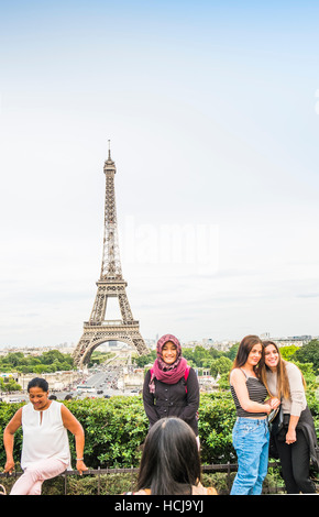 tourists taking photographs at  trocadero with eiffel tower as background Stock Photo