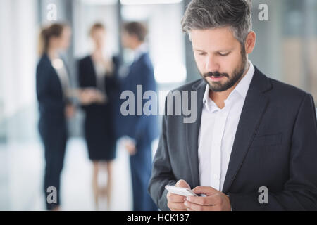 Businessman using mobile phone Stock Photo