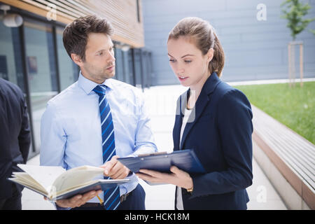 Businessman and colleague having discussion Stock Photo