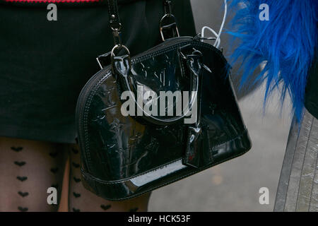 Woman with Louis Vuitton black crocodile leather bag before Gucci fashion  show, Milan Fashion Week street style on September 21 Stock Photo - Alamy