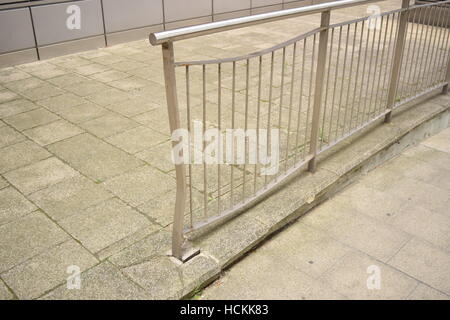 Dented metal railing on the roadside Stock Photo