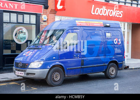G4S cash in transit security van outside a Ladbrokes betting shop in Chester, Cheshire, UK Stock Photo