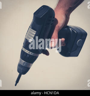 hand holding drilling machine / electric screwdriver