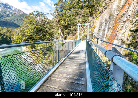 Step on a suspension bridge at Blue Pool, New Zealand Stock Photo