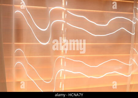 Closed curtains with light shining through Stock Photo