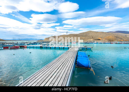 Salmon Fish farm floating on the glacial waters of Wairepo Arm, Twizel, South Island, New Zealand Stock Photo