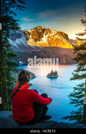 Visiting Oregon Woman Tourist Looking at Phantom Ship Rock Island Crater Lake National Park Stock Photo