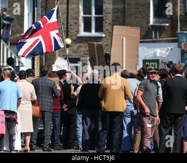 A scene portraying a race riot in Brixton in 1971 for the Sky Atlantic mini-series Guerrilla, starring Idris Elba, being filmed in North London  Featuring: Atmosphere Where: London, United Kingdom When: 17 Aug 2016 Stock Photo