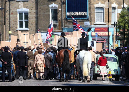 A scene portraying a race riot in Brixton in 1971 for the Sky Atlantic mini-series Guerrilla, starring Idris Elba, being filmed in North London  Featuring: Atmosphere Where: London, United Kingdom When: 17 Aug 2016 Stock Photo