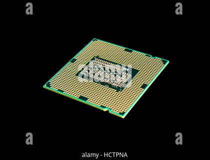 Electronic collection - CPU from the bottom side isolated on black background Stock Photo
