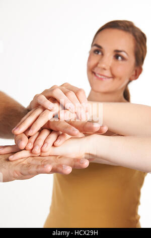 Group Of Young Friends Joining Hands Together Stock Photo