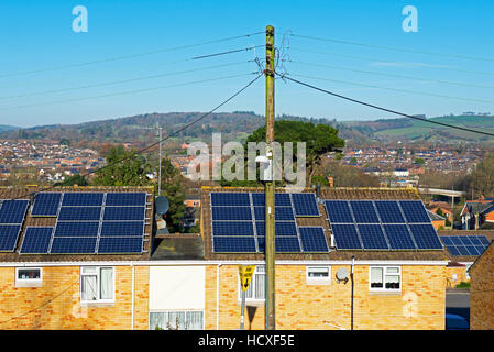 Solar panels on house roofs, England UK Stock Photo