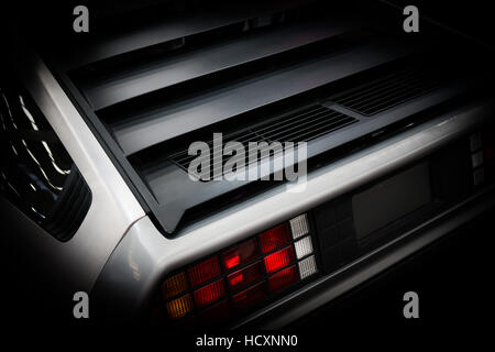 Rear of a Delorean DMC-12 car with the number plate 
