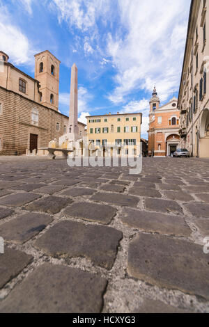 Historical buildings and obelisk of the ancient Piazza Federico II, Jesi, Province of Ancona, Marche, Italy Stock Photo