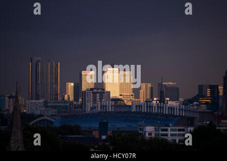 Canary Wharf, Docklands, at sunset from the top of Primrose Hill, London, UK Stock Photo