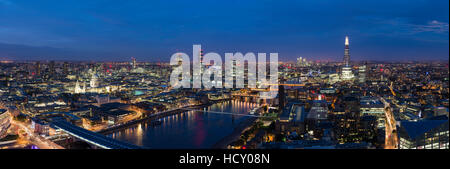 A night-time panoramic view of London and the River Thames, showing The Shard and St. Paul's Cathedral, London, UK Stock Photo
