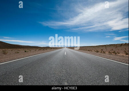 Road leading towards the Salinas Grandes (salt flats) near Purmamarca, Argentina Stock Photo