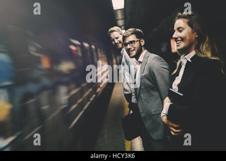 Business people waiting for metro in subway Stock Photo