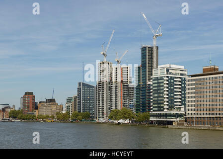 New apartments and tower blocks under construction alongside the RIver Thames in Lambeth London UK Stock Photo