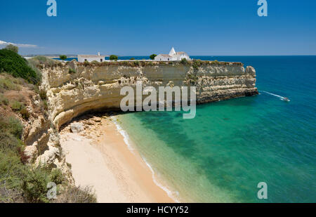 Portugal, the Algarve, Armacao de Pera, Nossa Senhora da Rocha empty beach and chapel on the cliffs. Stock Photo