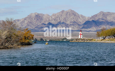 Replica of East Quoddy Lighthouse North end of Bridgewater Channel, in Lake Havasu State Park with mountains and kayaker Stock Photo