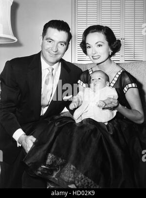 From left: James McNulty, Ann Blyth filling out their marriage licence ...