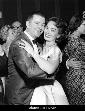 Ann Blyth with husband Dr. James McNulty who is holding their newborn ...