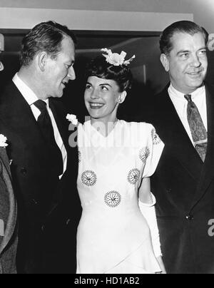 John Wayne and wife, Esperanza Baur, relaxing at home playing chess