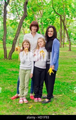 Photo of group people are eating bananas Stock Photo