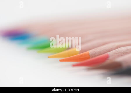 Colouring pencils lined up together, focused on orange pencil Stock Photo