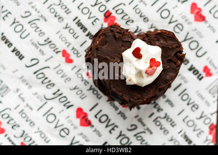 cakes in the form of the heart with the inscription on a napkin. Stock Photo