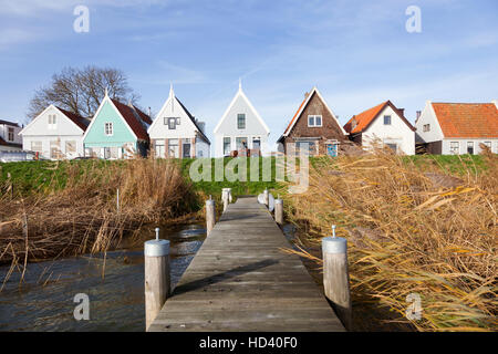 jetty and old wooden houses on the dike of durgerdam near amsterdam in the netherlands Stock Photo