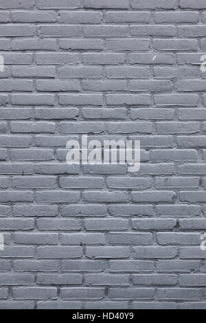 background consisting of vertical part of gray painted brick wall Stock Photo