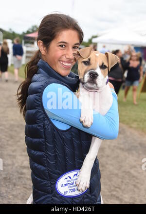 Matt Lauer and family adopt a dog from the ASPCA during the Hampton Classic Horse Show  Featuring: Romy Lauer and Mocha the dog Where: Bridgehampton, New York, United States When: 05 Sep 2016 Stock Photo