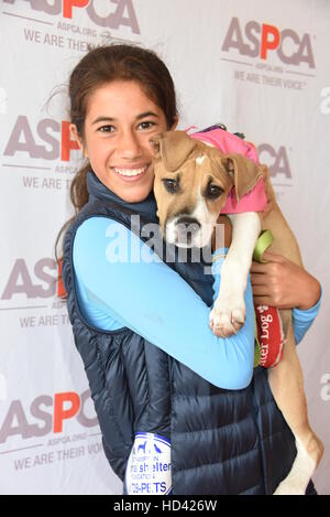 Matt Lauer and family adopt a dog from the ASPCA during the Hampton Classic Horse Show  Featuring: Romy Lauer and Mocha the dog Where: Bridgehampton, New York, United States When: 05 Sep 2016 Stock Photo