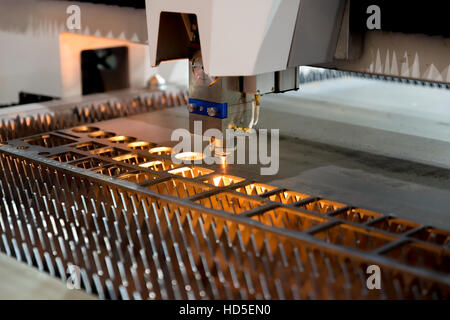High precision CNC laser cutting metal sheet and metal pipe in factory. Stock Photo