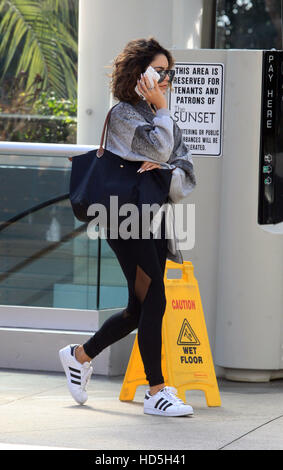 Vanessa Hudgens hides her face with her cell phones as she arrives at the gym in West Hollywood  Featuring: Vanessa Hudgens Where: West Hollywood, California, United States When: 07 Sep 2016 Stock Photo