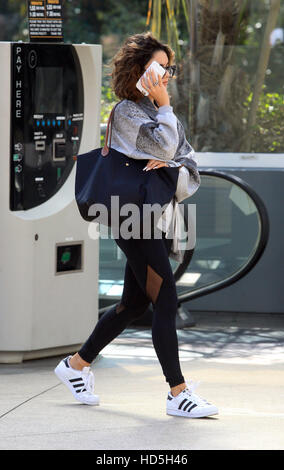 Vanessa Hudgens hides her face with her cell phones as she arrives at the gym in West Hollywood  Featuring: Vanessa Hudgens Where: West Hollywood, California, United States When: 07 Sep 2016 Stock Photo