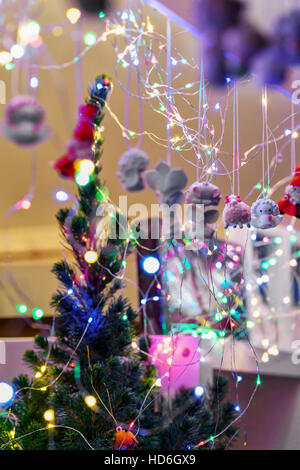 Xmas tree garland and decorations at one of the many stalls on the Christmas Market in Vilnius. Stock Photo